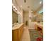 Large bathroom with dual sinks, vanity, and a walk-in shower at 636 Lakescene Drive Dr, Venice, FL 34293