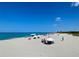 Beachfront view with people enjoying a sunny day at 636 Lakescene Drive Dr, Venice, FL 34293