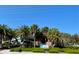 Venice Beach pavilion, surrounded by palm trees and lush landscaping at 636 Lakescene Drive Dr, Venice, FL 34293