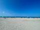 Expansive Venice Beach showcasing sand, ocean, and beachgoers at 636 Lakescene Drive Dr, Venice, FL 34293