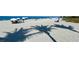 Peaceful beach scene with palm tree shadows on the sand at 636 Lakescene Drive Dr, Venice, FL 34293