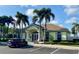 Community clubhouse with parking and landscaping at 636 Lakescene Drive Dr, Venice, FL 34293