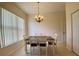 Small dining area with square table and four chairs at 636 Lakescene Drive Dr, Venice, FL 34293