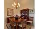 Formal dining room with wood table and hutch at 636 Lakescene Drive Dr, Venice, FL 34293