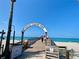 Entrance to Venice Fishing Pier, with beach and ocean views at 636 Lakescene Drive Dr, Venice, FL 34293