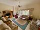 Spacious living room with seating area and view to backyard at 636 Lakescene Drive Dr, Venice, FL 34293