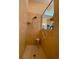 Walk-in shower with grab bar and tiled walls at 636 Lakescene Drive Dr, Venice, FL 34293
