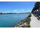 Scenic waterfront walkway with picnic tables at 636 Lakescene Drive Dr, Venice, FL 34293