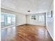 Spacious living room with hardwood floors and access to a sunroom at 7011 9Th W Ave, Bradenton, FL 34209