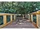 Wooden boardwalk path surrounded by lush trees and foliage at 7011 9Th W Ave, Bradenton, FL 34209