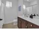 Clean bathroom with a shower/tub combo and dark vanity at 7817 Passionflower Dr, Sarasota, FL 34241
