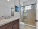 Bathroom with shower, toilet and a vanity with a sink at 7817 Passionflower Dr, Sarasota, FL 34241