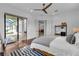 Bedroom with king bed, access to backyard, and walk-in closet at 7817 Passionflower Dr, Sarasota, FL 34241
