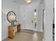 Bright and airy entryway with a console table and mirror at 7817 Passionflower Dr, Sarasota, FL 34241