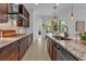 Spacious kitchen with stainless steel appliances, granite counters, and ample cabinetry at 7817 Passionflower Dr, Sarasota, FL 34241