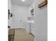 Bright laundry room with washer, dryer, and ample storage at 7817 Passionflower Dr, Sarasota, FL 34241