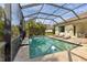 Screened pool and patio with lounge chairs at 7817 Passionflower Dr, Sarasota, FL 34241