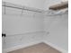 Well-organized walk-in closet featuring wire shelving and ample hanging space at 7817 Passionflower Dr, Sarasota, FL 34241