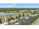 Condo building with parking and lakefront views at 7911 Grand Estuary Trl # 106, Bradenton, FL 34212