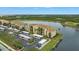Condo building with parking and lakefront views at 7911 Grand Estuary Trl # 106, Bradenton, FL 34212
