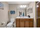 Clean bathroom with toilet, vanity, and shower at 7911 Grand Estuary Trl # 106, Bradenton, FL 34212