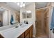 Modern bathroom with double sinks and glass shower at 7911 Grand Estuary Trl # 106, Bradenton, FL 34212