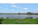 Peaceful lake view with lush green grass at 7911 Grand Estuary Trl # 106, Bradenton, FL 34212