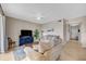 Open concept living room with access to hallway and kitchen at 7911 Grand Estuary Trl # 106, Bradenton, FL 34212