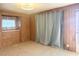 Bright bedroom with wood paneling and built-in dresser at 810 51St W Ave, Bradenton, FL 34207