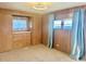 Spacious bedroom with wood paneling and ample closet space at 810 51St W Ave, Bradenton, FL 34207