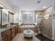 Spa-like bathroom with soaking tub and walk-in shower at 8107 High Oaks Trl, Myakka City, FL 34251