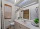 Bright bathroom with updated vanity and shower at 8107 High Oaks Trl, Myakka City, FL 34251