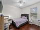 Charming bedroom with a desk, lavender bedding and hardwood floors at 8107 High Oaks Trl, Myakka City, FL 34251