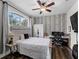 Bright bedroom with built-in workspace and window seat at 8107 High Oaks Trl, Myakka City, FL 34251