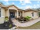 Front entry with blue door and brick walkway at 8107 High Oaks Trl, Myakka City, FL 34251