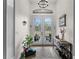 Bright and spacious entryway with double doors leading outside at 8107 High Oaks Trl, Myakka City, FL 34251