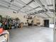 Spacious garage with ample storage shelves at 8107 High Oaks Trl, Myakka City, FL 34251