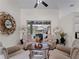 Cozy Gathering room featuring comfortable seating and view of the pool at 8107 High Oaks Trl, Myakka City, FL 34251