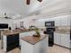 Large kitchen island and breakfast bar in a bright kitchen at 8107 High Oaks Trl, Myakka City, FL 34251