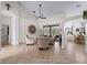 Bright living room with high ceilings and tiled floors at 8107 High Oaks Trl, Myakka City, FL 34251