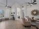 Spacious living area with multiple seating areas and high ceilings at 8107 High Oaks Trl, Myakka City, FL 34251