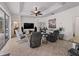 Relaxing living room with rocking chairs and a large TV at 8107 High Oaks Trl, Myakka City, FL 34251