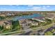 Luxury home with lake views and landscaped yard in a residential community at 9020 Artisan Way, Sarasota, FL 34240