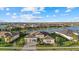 Luxury home on a lake with a two-car garage and manicured lawn at 9020 Artisan Way, Sarasota, FL 34240