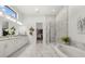 Elegant bathroom with double vanity, soaking tub, and walk-in shower at 9020 Artisan Way, Sarasota, FL 34240