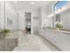 Spa-like bathroom with double vanity, soaking tub and walk-in shower at 9020 Artisan Way, Sarasota, FL 34240