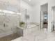 Modern bathroom with a walk-in shower and soaking tub at 9020 Artisan Way, Sarasota, FL 34240