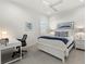 Spacious bedroom featuring a bed, desk, and calming decor at 9020 Artisan Way, Sarasota, FL 34240