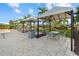 Relaxing cabanas with tables and chairs at 9020 Artisan Way, Sarasota, FL 34240