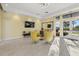 Relaxing community room with comfortable seating and large TV at 9020 Artisan Way, Sarasota, FL 34240